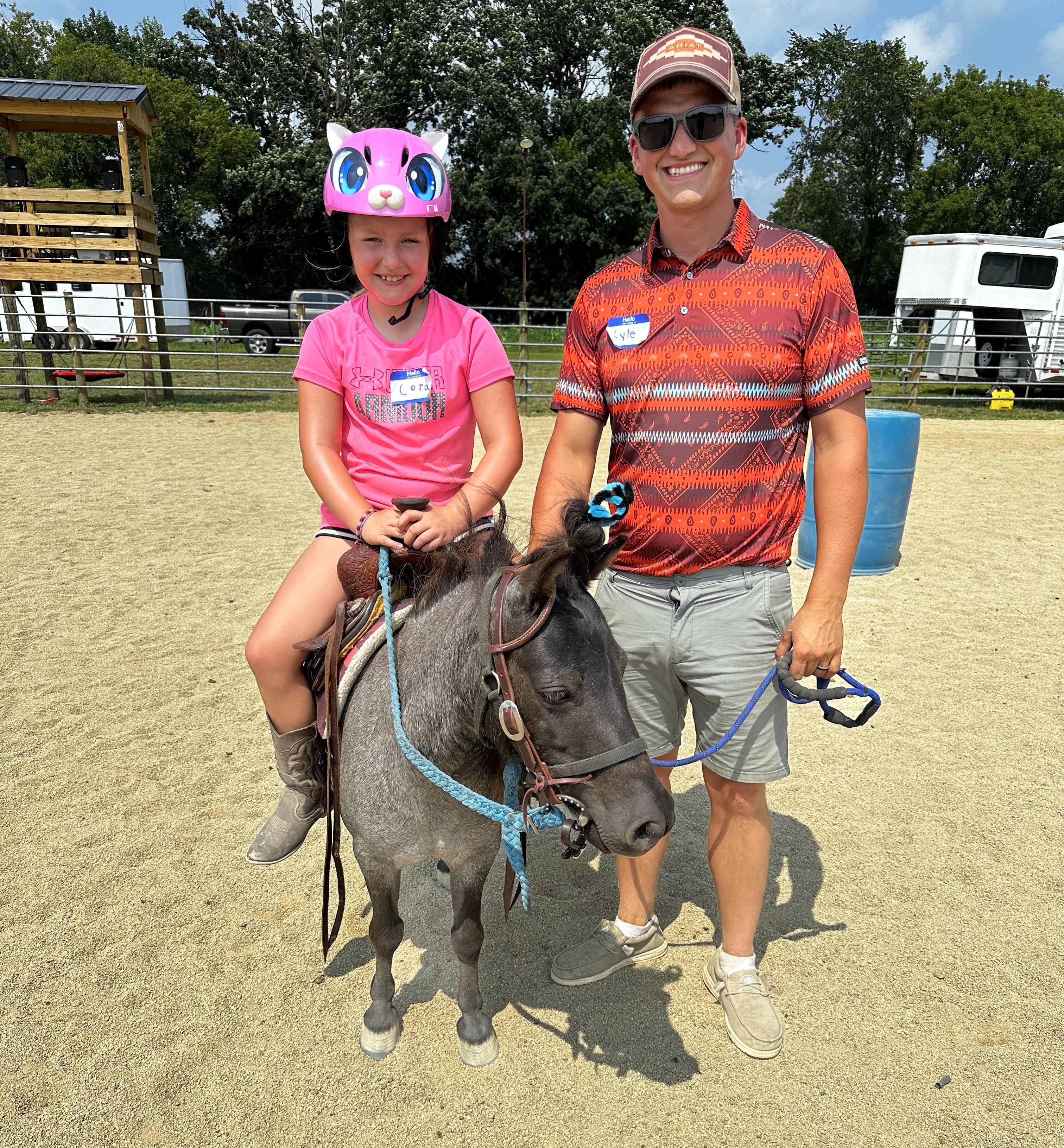 A child riding a pony at a Pony Parties Express event